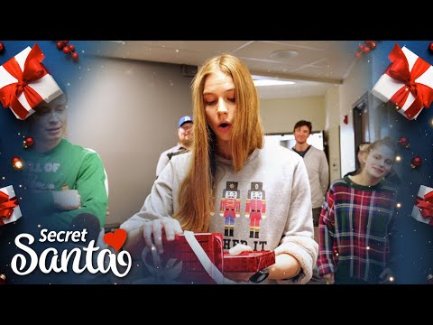 Woman gets surprise from Secret Santa during a class party that will allow her to stay in school